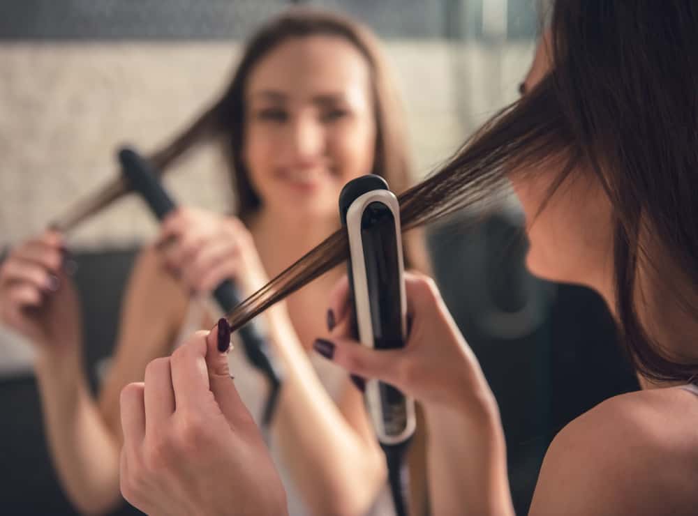 Set your flat iron tool at low heat